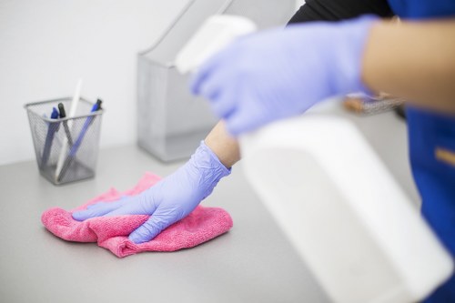 Professional Airbnb cleaner preparing a Westminster short-let apartment for guest arrival