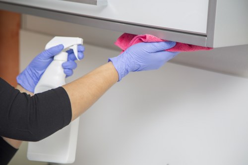 Technician treating mattress stains during a local cleaning appointment